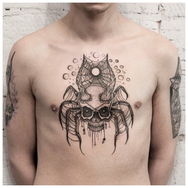 Un tatuaj de păianjen în stilul unui piept do-it-yourself pe un bărbat